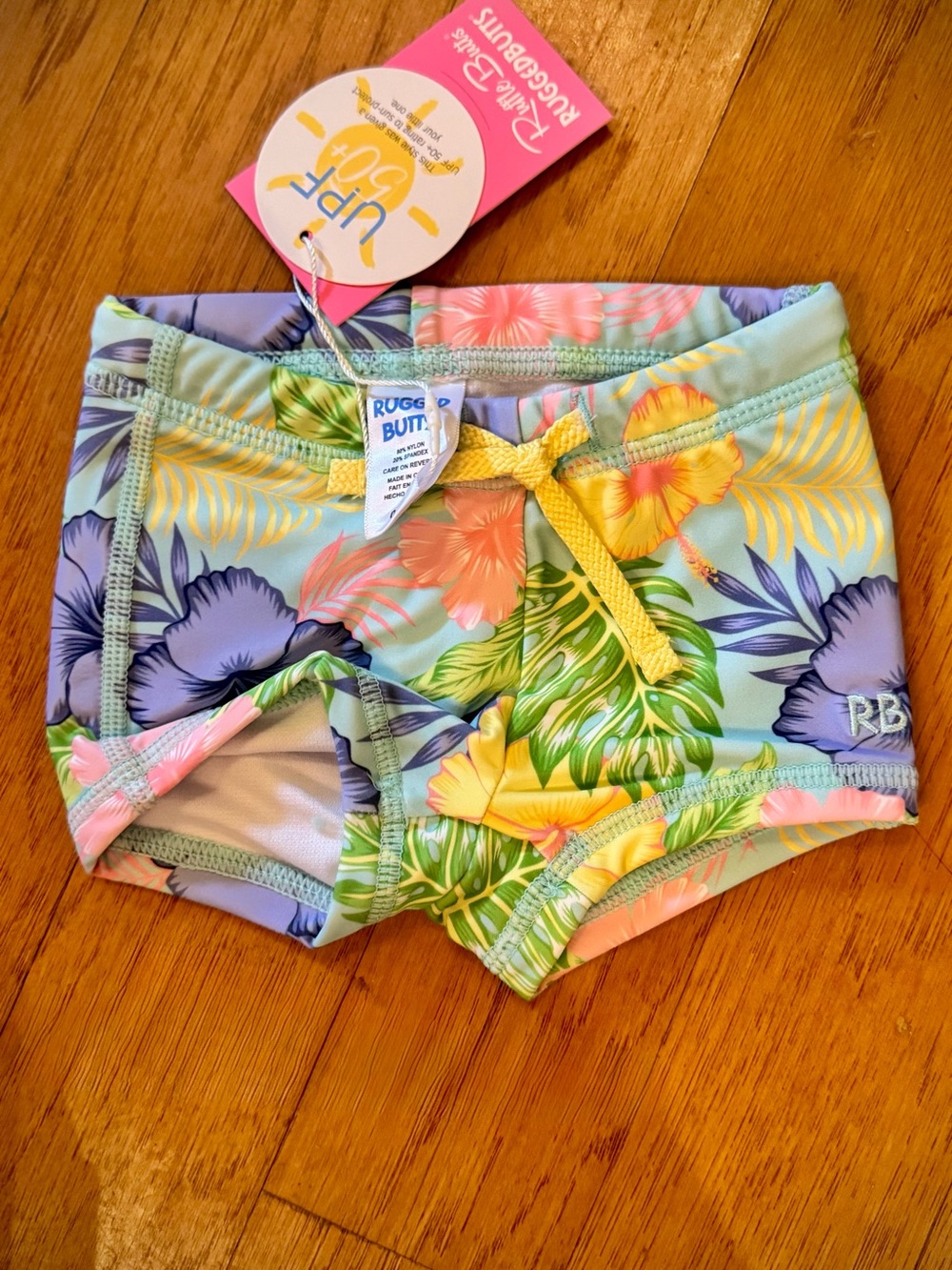 NWT Ruffle Butts Aloha Blossoms Swim Shorties with Yellow Drawstring